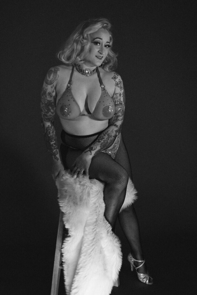classic showgirl pin up burlesque dancer in net bra with fishnets